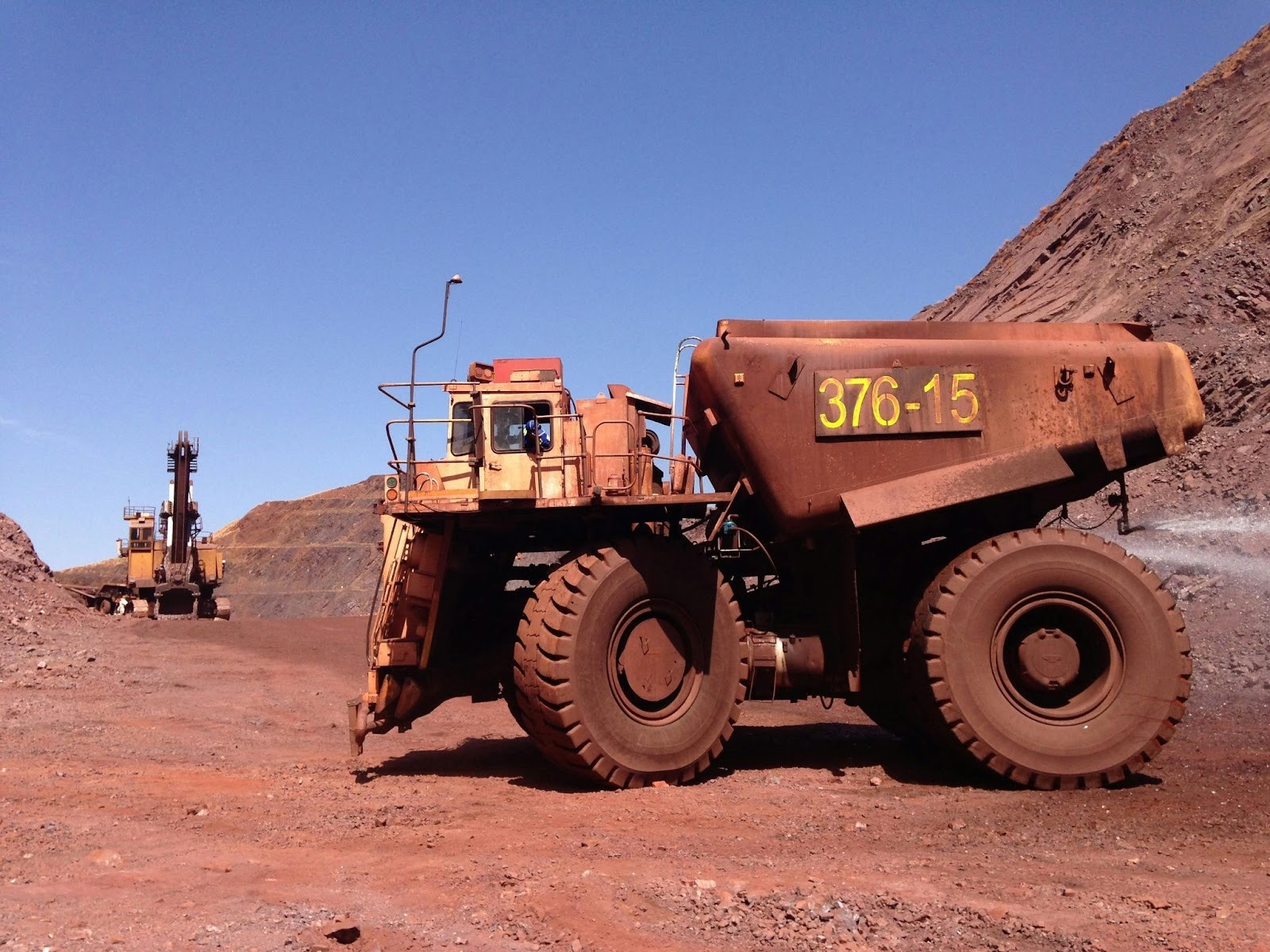Heavy mining equipment operating at a mine site